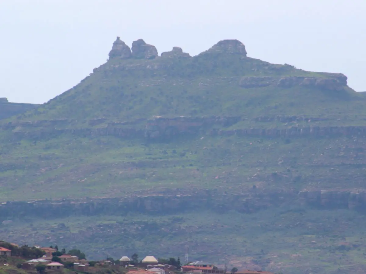Village homes below the sandstone peaks